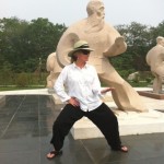 Troyce posing like one of the statues at the Chen Museum